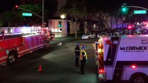 Paramedics respond after numerous people are injured Wednesday night after a car drove into a crowd in Redondo Beach at Pacific Coast Highway and Vincent Street. (Credit: Los Angeles Times)