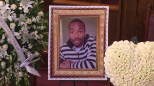 A framed portrait of Ezell Ford is seen at his funeral in South Los Angeles on Saturday, Aug. 30, 2014. (Credit: KTLA)