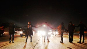 Demonstrators block the southbound 110 Freeway, protesting in the wake of the release of Ezell Ford's autopsy on Dec. 29, 2014. (Credit: Los Angeles Times)