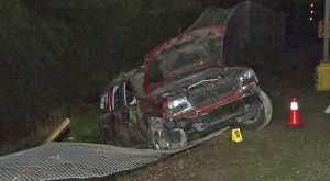 One person was killed and three others injured when a car plunged off an on-ramp to the 118 Freeway in Pacoima on Dec. 3, 2014.  (Credit: KTLA)