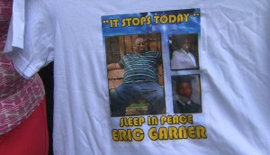 Eric Garner's photo is seen on a T-shirt worn in a protest march in New York. (Credit: WPIX via CNN) 