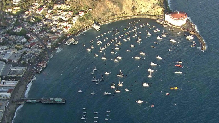 Avalon Harbor is shown from Sky5 on Dec. 31, 2014. Several boats can be seen ashore near the pier. (Credit: KTLA)