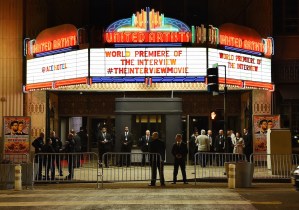 Security is seen outside The Theatre at Ace Hotel before the premiere of the film 'The Interview' in Los Angeles, California on December 11, 2014. (Credit: AFP/Getty Images)