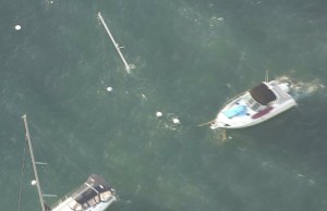 One boat appeared to have sunk and only its mast was sticking up above the water in Avalon Harbor on Dec. 31, 2014. (Credit: KTLA)