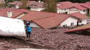 Several homes in Camarillo Springs had mud and debris up to their rooftops after a downpour Friday morning. (Credit: KTLA)