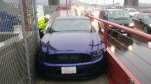 A Ford Mustang got stuck on the sidewalk of the Golden Gate Bridge on Dec. 2, 2014. (Credit: CNN) 