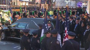 Police officers from around the nation gathered Dec. 27, 2014, for NYPD Officer Rafael Ramos' funeral. (Credit: CNN)