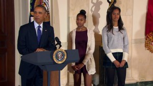 From left, President Barack Obama and his daughters, Sasha and Malia, are seen during a turkey pardoning ceremony at the White House on Wednesday, Nov. 26, 2014. (Credit: CNN)