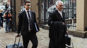 Barry Roux, right,, defense lawyer of South African Paralympic athlete Oscar Pistorius, arrived at the High Court in Pretoria on Dec. 9, 2014, for the appeal hearing against Pistorius' five year jail sentence by the state for shooting his model girlfriend dead in February 2013. (Credit: GIANLUIGI GUERCIA/AFP/Getty Images)