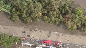 Two people were rescued from the raging Los Angeles River on Dec. 12, 2014. (Credit: KTLA)