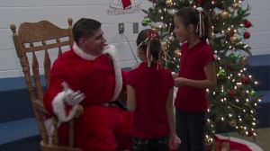 A Texas father and soldier surprised his two daughters in December 2014, after returning home from Germany after 10 months. (Credit: KIII via CNN)