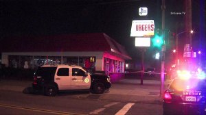 A 21-year-old man was killed after a gunman opened fire at a group of people in a Lennox parking lot on Dec. 28, 2014. (Credit: OnScene TV) 