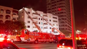     Firefighters responded after a fire broke out at an apartment building in Westwood on Saturday, Dec. 20, 2014. (Credit: Sam Jadali)