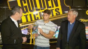 Ryan Ferguson, center, was presented with complimentary Super Bowl tickets as his father, right, looked on. (Credit: KPHO-TV)