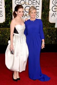 Hosts Tina Fey, left, and Amy Poehler attend the 72nd Annual Golden Globe Awards at The Beverly Hilton Hotel on Sunday, Jan. 11, 2015, in Beverly Hills. (Credit: Jeff Vespa/WireImage)