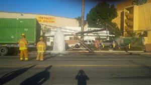 A semitrailer toppled a power pole and sheared a fire hydrant in Montebello on Saturday, Jan. 24, 2014. (Credit: Montebello Police Department)