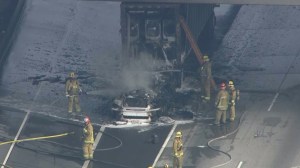 Fire crews knocked down a big rig fire that erupted on the 10 Freeway near the 710 Freeway on Jan. 13, 2015. (Credit: KTLA)