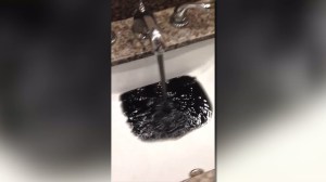 A Gardena woman recorded what looks and smells like "black sludge and sediment" coming her water faucet.