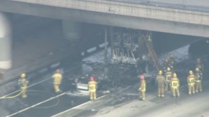 Fire crews were at the scene of a big rig fire on the 10 Freeway in East L.A. on Jan. 13, 2015. (Credit: KTLA)