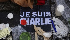 Tributes are left close to the Charlie Hebdo offices on a day of mourning following a terrorist attack on the satirical newspaper building on January 8, 2015 in Paris, France.  (Credit: Marc Piasecki/Getty Images)