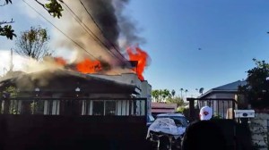 An image from a cellphone video shows a fire that broke out at a home in Van Nuys on Sunday, Jan. 4, 2014.