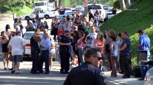 Onlookers watch after a school bus crash in Anaheim Hills on April 24, 2014. (Credit: OnScene.TV)