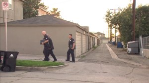 LAPD investigators were on scene in the alley where Jamar Nicholson was shot on Feb. 10, 2015. (Credit: KTLA)