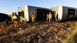 Firefighters and first responders on the scene of a Metrolink train derailment in Oxnard on Feb. 24, 2015. (Credit: Al Seib / Los Angeles Times)