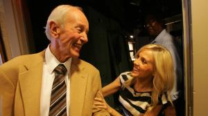 Stan Chambers is congratulated by colleague Jessica Holmes after he made his last broadcast in 2010 in a career that spanned more than six decades at KTLA. (Credit: Bob Chamberlin / Los Angeles Times)