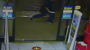 A still from a surveillance video released by Covina police shows a man armed with a knife chasing after a stabbing victim on Jan. 31, 2015. 