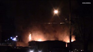 A home caught fire during a standoff in Lancaster on Feb. 6, 2015. (Credit: Don Luis Meza) 