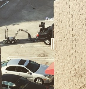 A bomb squad robot works at the scene of an investigation in Hollywood on Feb. 19, 2015. (Credit: Geoff Pilkington)