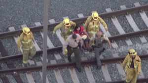 One woman was helped off a train that derailed at Union Station on Feb. 10, 2015. (Credit: KTLA)