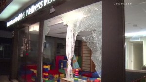 One of multiple Long Beach businesses with blown out windows due to a vandalism spree on Feb. 2, 2015, is pictured (Credit: LOUDLABS)