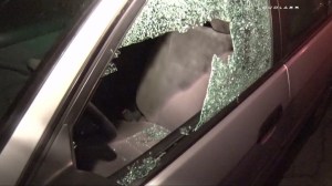 At least 21 vehicles and Long Beach businesses had shattered windows on Feb. 3, 2015, after a vandalism spree. (Credit: LOUDLABS)