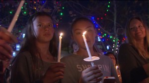 Hundreds gathered at candlelight vigil on Friday, Feb. 6, 2015 for a Manhattan Beach family who believed they were the target of a hate crime. (Credit: KTLA)