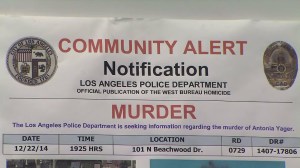 A flier regarding the killing of Antonia Yager was displayed at a Feb. 5, 2015, LAPD news conference. (Credit: KTLA)