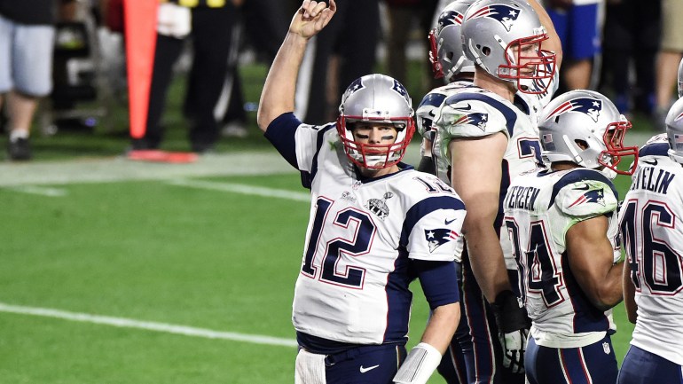 Tom Brady #12 of the New England Patriots celebrates in the final seconds against the Seattle Seahawks in the fourth quarter during Super Bowl XLIX at University of Phoenix Stadium on February 1, 2015 in Glendale, Arizona. (Credit: Harry How/Getty Images)