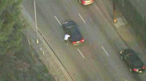 A pursuit suspect is seen trying to carjack a vehicle in East Los Angeles on Monday, Feb. 9, 2015. (Credit: KTLA)