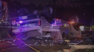 A hit-and-run caused a white Ford Bronco to overturn on the 60 Freeway, and a SigAlert to be issued on Feb. 23, 2015, according to CHP. (Credit: KTLA)