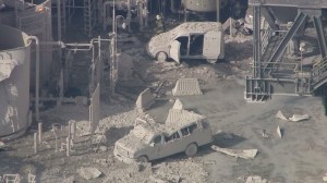 Ash-covered vehicles appeared to have been damaged in the fire at the ExxonMobil Torrance Refinery on Feb. 18, 2015. (Credit: KTLA)