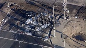 A vehicle is pictured after being struck by a train and becoming fully engulfed in flames on Feb. 24, 2015. (Credit: KTLA)