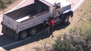 A dump truck fatally struck a skateboarder on Glendora Mountain Road on March 20, 2015. (Credit: KTLA)