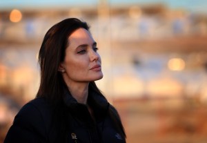 US actress and UNHCR ambassador Angelina Jolie stands during a visit to a camp for displaced Iraqis in Khanke on Jan. 25, 2015. (Credit: SAFIN HAMED/AFP/Getty Images)