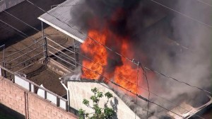 A fire burned at a home in Burbank on March 20, 2015. (Credit: KTLA)