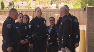 LAPD officers meet after nine Venice High School students were arrested on March 13, 2015, for allegedly sexually assaulting two girls. (Credit: KTLA)