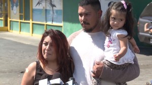 With her husband and young daughter beside her, Maria Uriostegui described being hit by a car after confronting diners about their unpaid bill. (Credit: KTLA) 