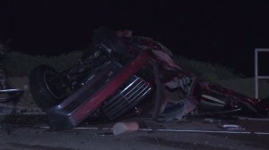 A Mercedes-Benz split into two following a head-on crash on PCH Tuesday, March 17, 2015. (Credit: KTLA)  