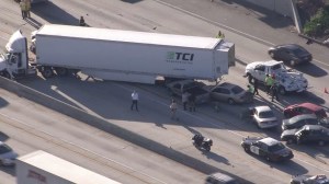 A semitrailer and 11 other vehicles were involved in a crash on the 10 Freeway in Ontario on Wednesday, March 25, 2015. (Credit: KTLA)