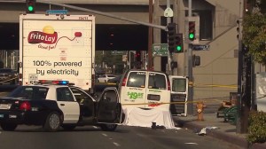 A man died after getting dragged beneath a U-Haul for several miles. The van finally came to a stop on Pacific Coast Highway in Wilmington. (Credit: KTLA)